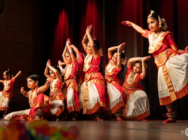 Artists sharing a coordinated stage performance